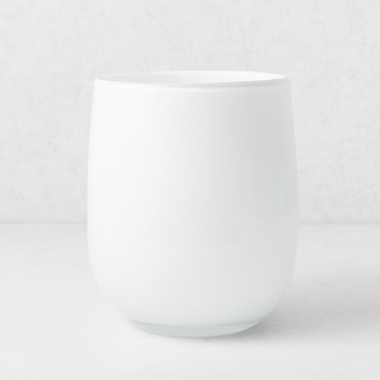 Handblown opaque white glass barrel vase with a modern curved silhouette, 9 inches tall.