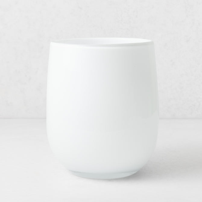 Handblown opaque white glass barrel vase with a modern curved silhouette, 9 inches tall.