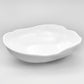 Large white organic melamine serve bowl with a sculptural shape.