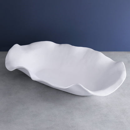 Large white melamine oval centerpiece with sculptural, wavy edges.