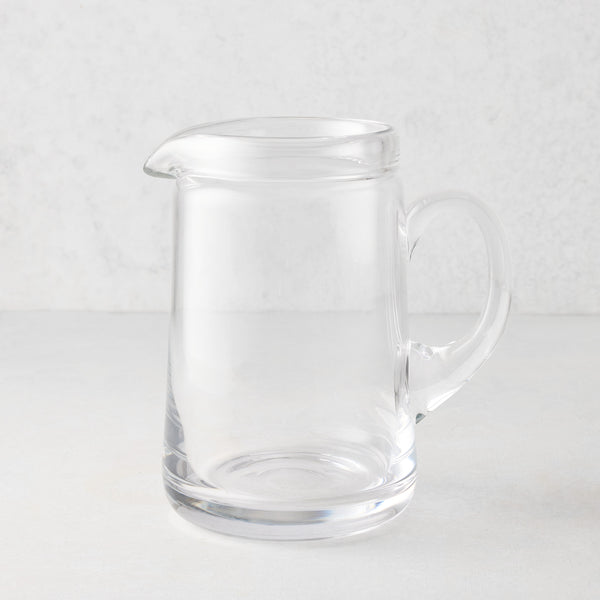 Large Oxford clear glass pitcher with hand-molded rim and handle.