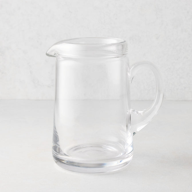 Large Oxford clear glass pitcher with hand-molded rim and handle.