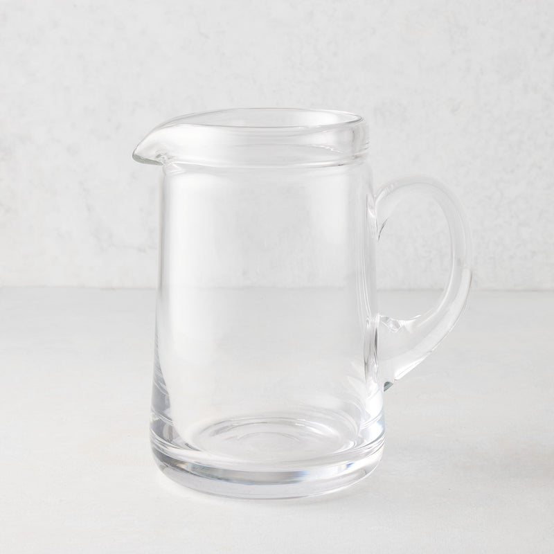 Large Oxford clear glass pitcher with hand-molded rim and handle.