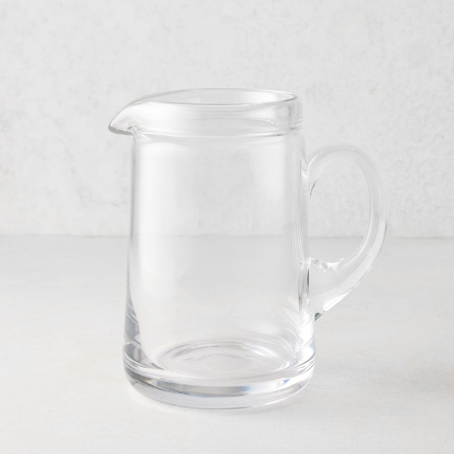 Large Oxford clear glass pitcher with hand-molded rim and handle.