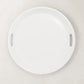 Creamy white ceramic round serving tray with integrated handles, 16.5" diameter.