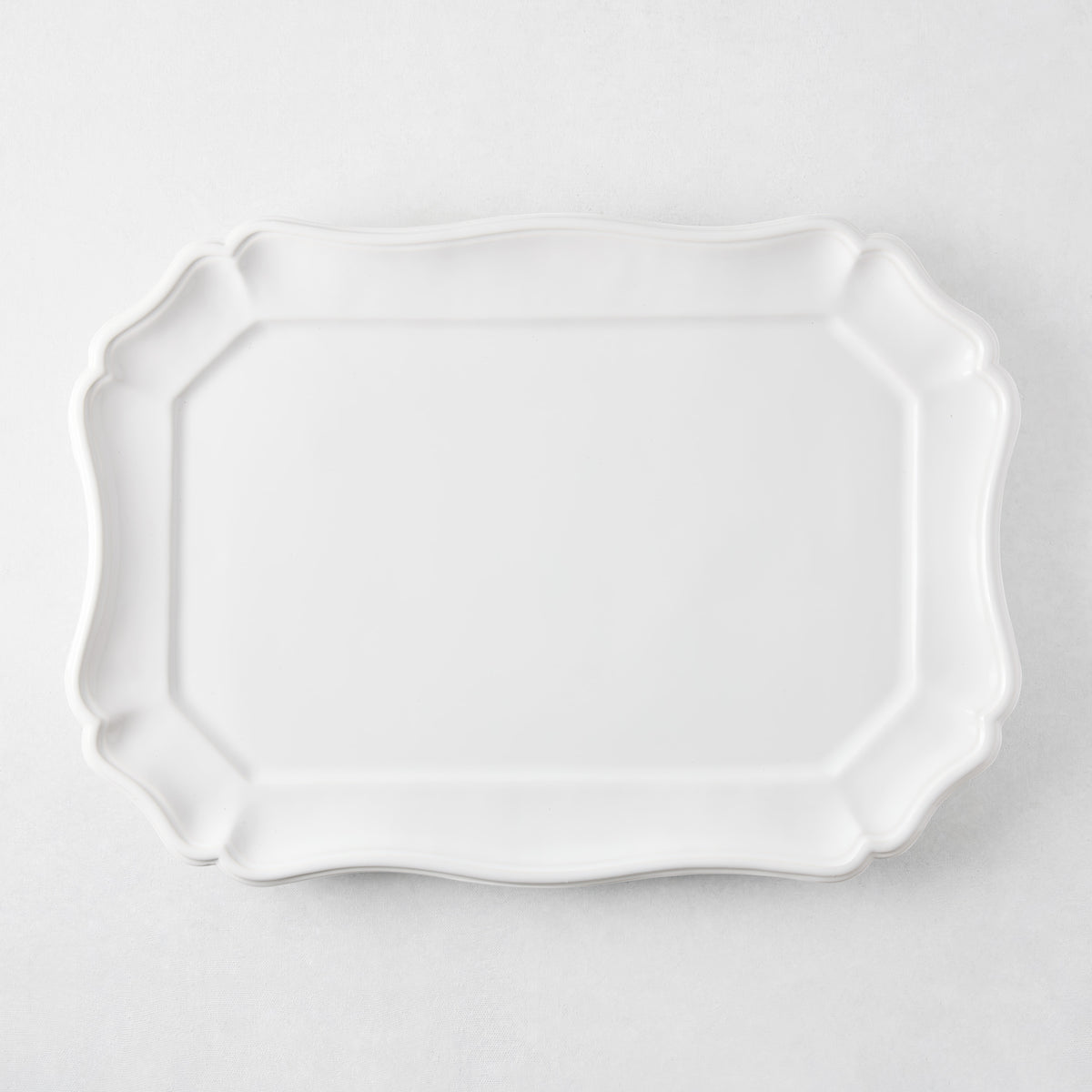 Large white ceramic rectangular serve platter with scalloped edges, 19 by 14 inches, made in Italy.