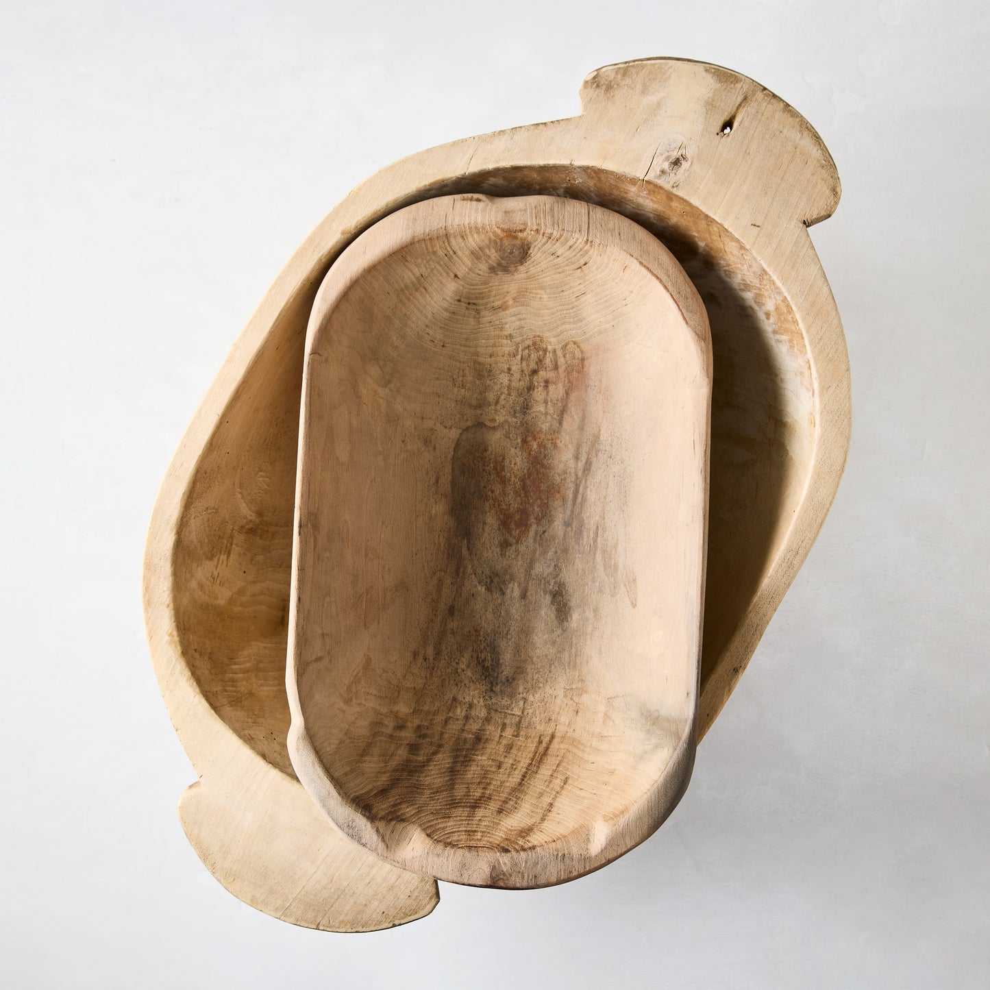 Large vintage reclaimed wood bowl with natural grain and rich patina, nested with a smaller wood bowl.