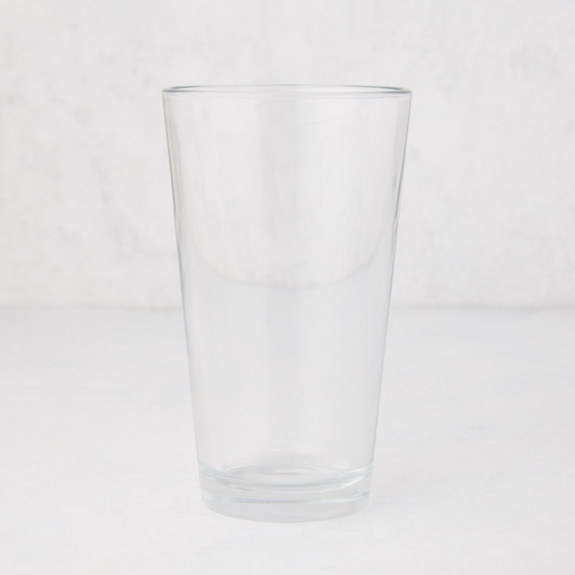 Clear, tall Hudson Grace 12oz drinking glass with thick walls, 6"H.