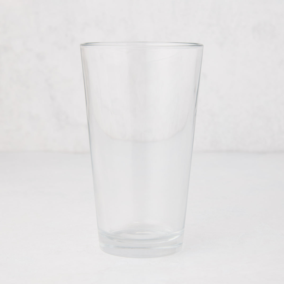 Clear, tall Hudson Grace 12oz drinking glass with thick walls, 6"H.
