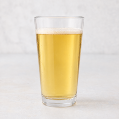 Clear 12oz tall drinking glass filled with golden beer, featuring a thick-walled base on a white surface.