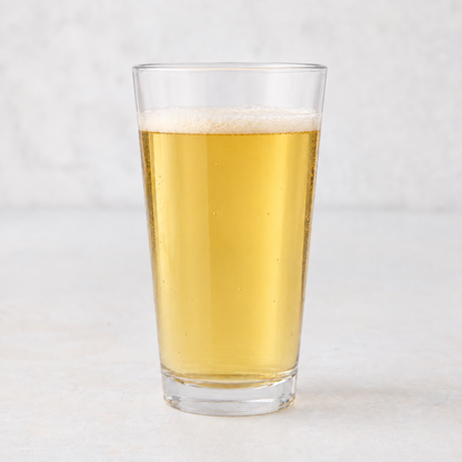 Clear 12oz tall drinking glass filled with golden beer, featuring a thick-walled base on a white surface.