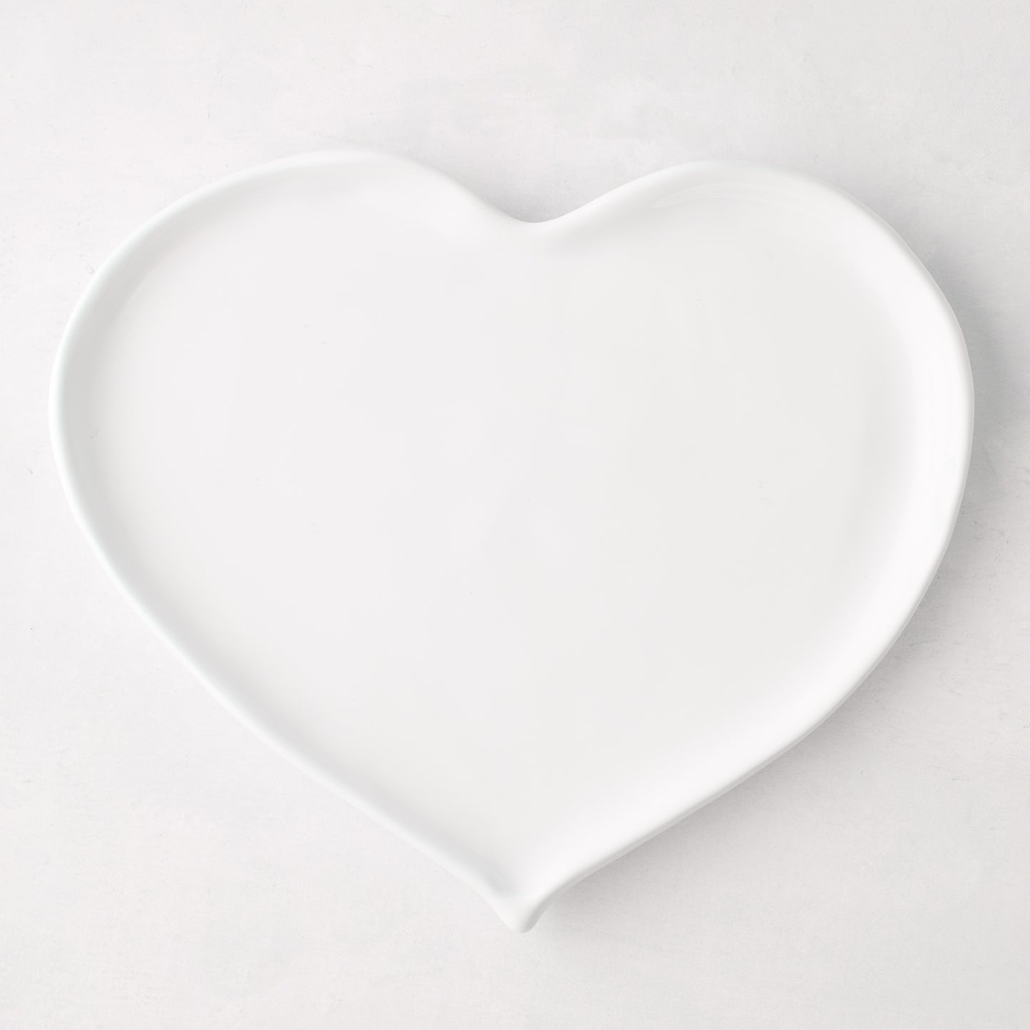 Large white ceramic heart-shaped dish, handmade in Italy.