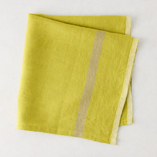 Folded Laundered Lime Green Linen Napkin with a paler vertical stripe, 22" square.