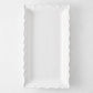 Rectangular white ceramic serve platter with a decorative scalloped edge, 13.77 inches long, made in Italy.