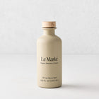 Le Marké organic balsamic vinegar in a matte beige glass bottle with a wooden stopper, 6.8 oz size.