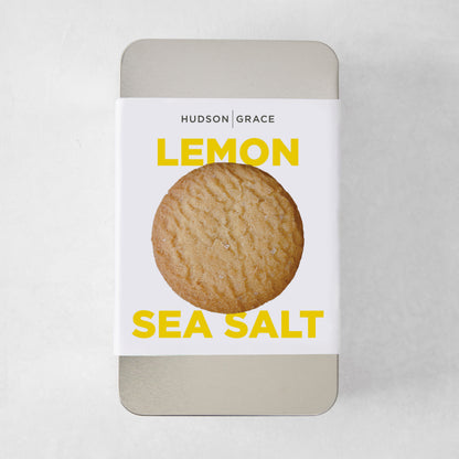 Hudson Grace Lemon Sea Salt Cookie Gift Tin with a single cookie on the label.