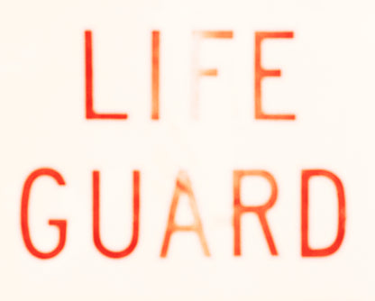 Matt Albiani's "LIFEGUARD" art print, red text with a faded effect on a light background.
