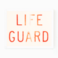 Matt Albiani's "Lifeguard" photograph: blurred red text on a light background in a white frame.