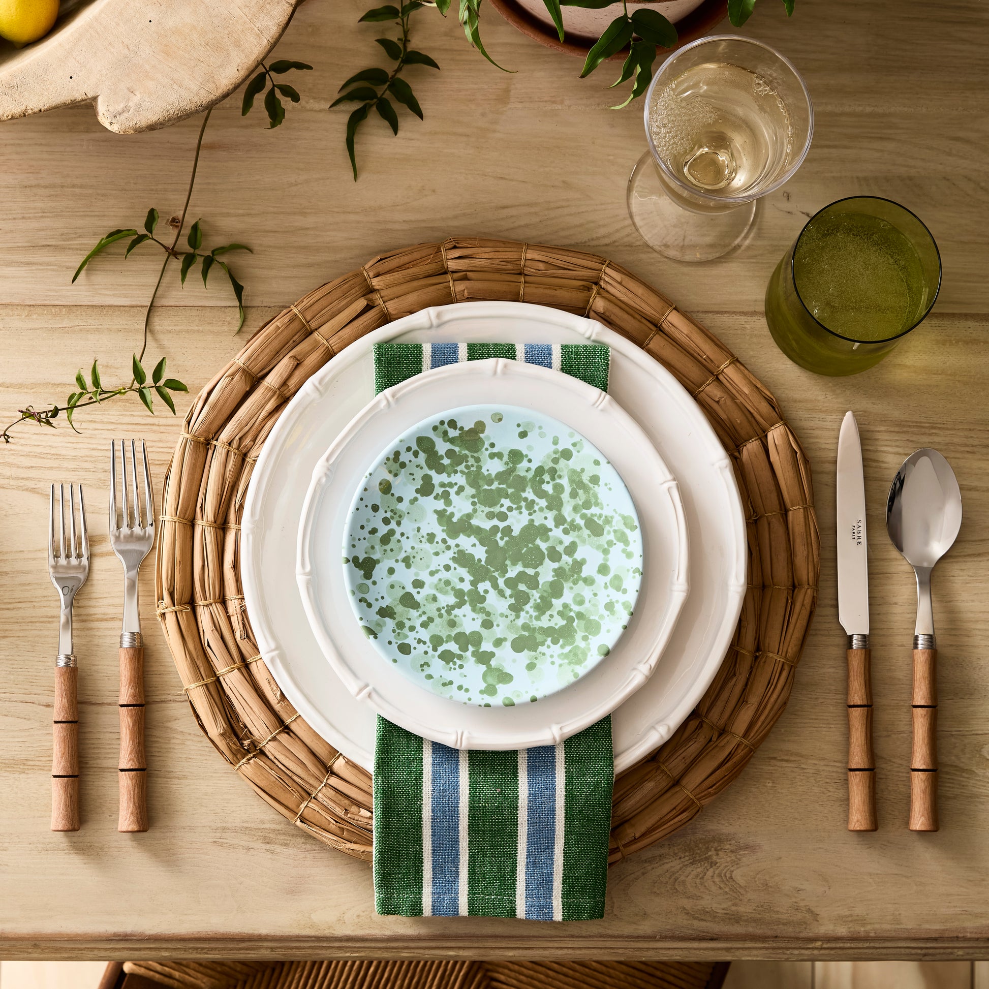 5-piece flatware set with natural wood handles and stainless steel, featuring a modern bamboo-inspired design.