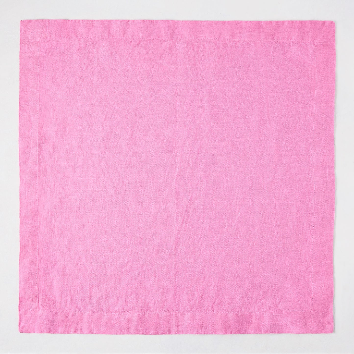 Lily HG Signature 22-inch square hand-dyed pink linen napkin with mitered corners.