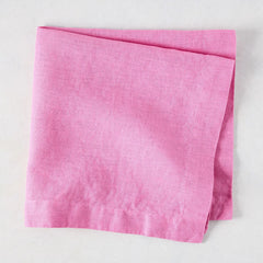 Lily HG Signature hand-dyed pink linen napkin, folded, 22-inch square.