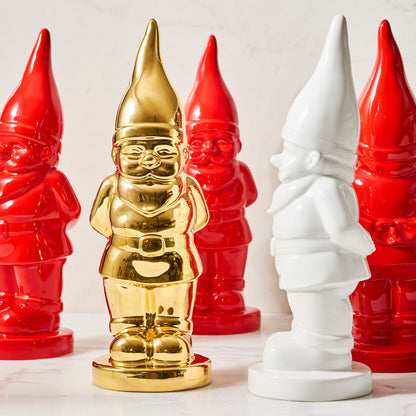 Limited Edition Gold Ceramic Holiday Gnome, surrounded by red and white ceramic gnomes.