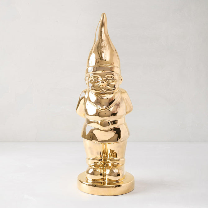 Limited Edition Gold Ceramic Holiday Gnome with brilliant hand-applied gold glaze, designed for modern holiday homes.