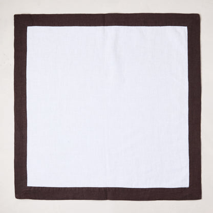 White linen napkin with a cocoa brown border, 22x22 inches.