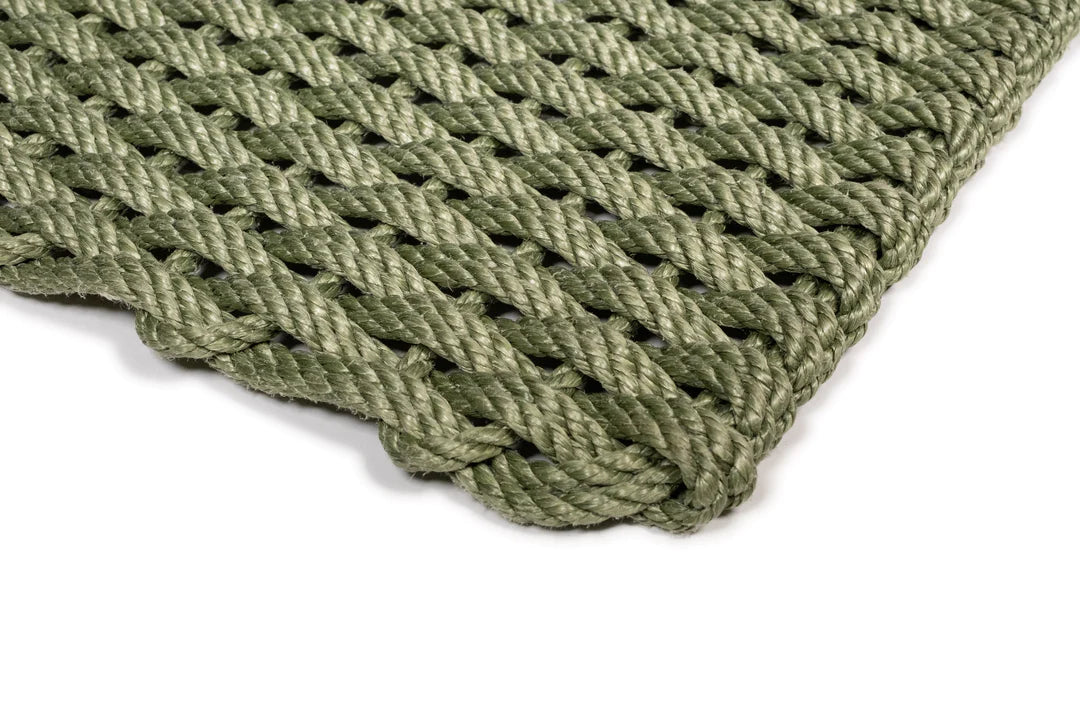 Handwoven Loden Green Rope Doormat with a tight, braided weave and rounded corner.