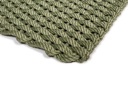 Handwoven Loden Green Rope Doormat with a tight, braided weave and rounded corner.