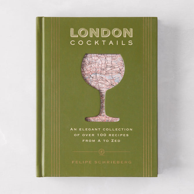 Green hardcover "London Cocktails" recipe book with a map-filled cocktail glass design.