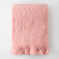 Folded Lotus Pale Pink Solid Mohair Throw Blanket, 72"L x 51"W, with fringed ends.
