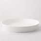 Luce Large white ceramic serving dish, 15" diameter, with a minimalistic, sleek design.