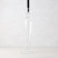 Lumière Glass Single Candlestick, 16"H, clear glass with a black taper candle.