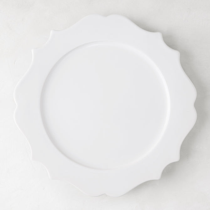 White 11" Lungarno ceramic dinner plate with sculptural, scalloped edges.