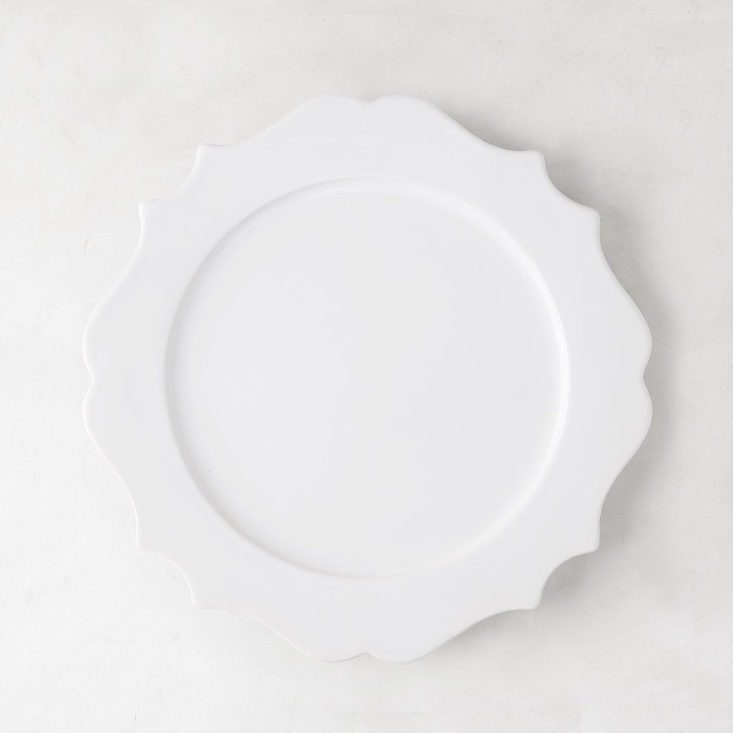 Lungarno 9" white ceramic salad/dessert plate with sculptural, scalloped edges.