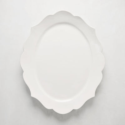 White ceramic Lungarno serving platter with sculptural, scalloped edges.