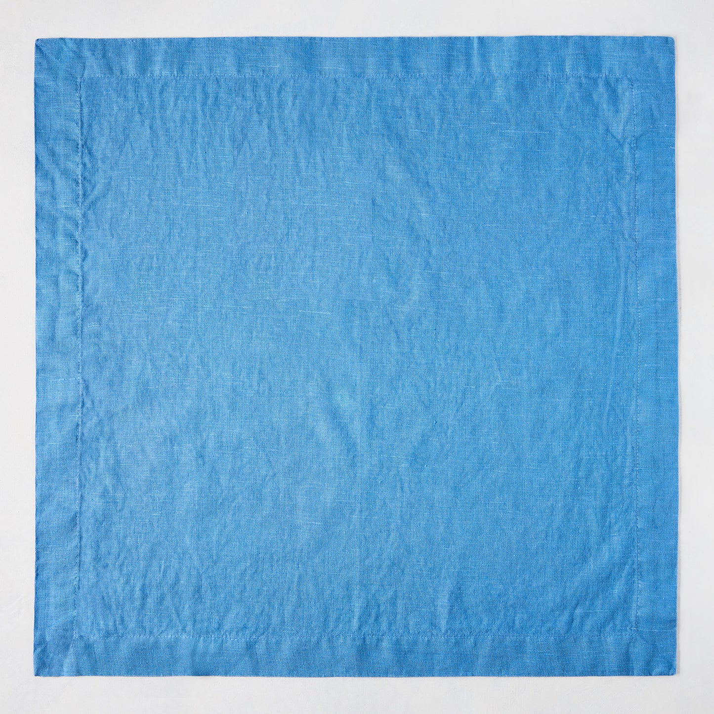 Lupine Blue HG Signature hand-dyed 22-inch linen napkin with mitered corners.