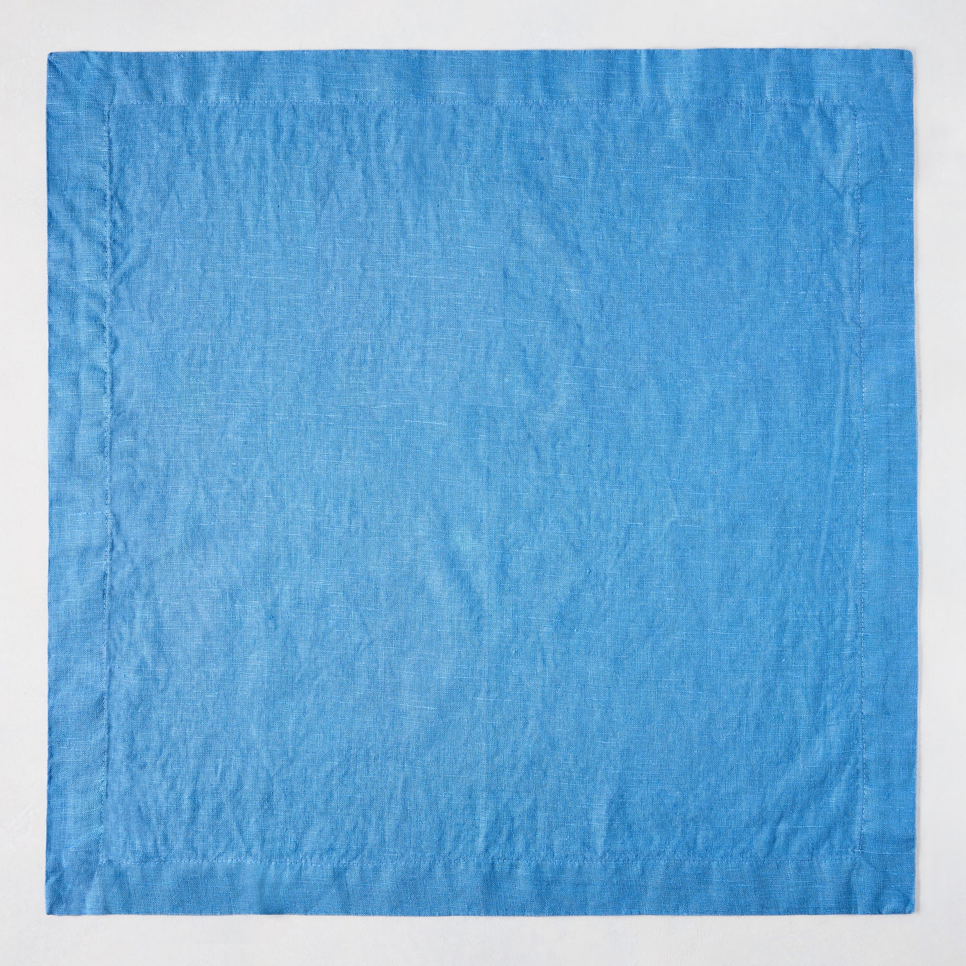 Lupine Blue HG Signature hand-dyed 22-inch linen napkin with mitered corners.