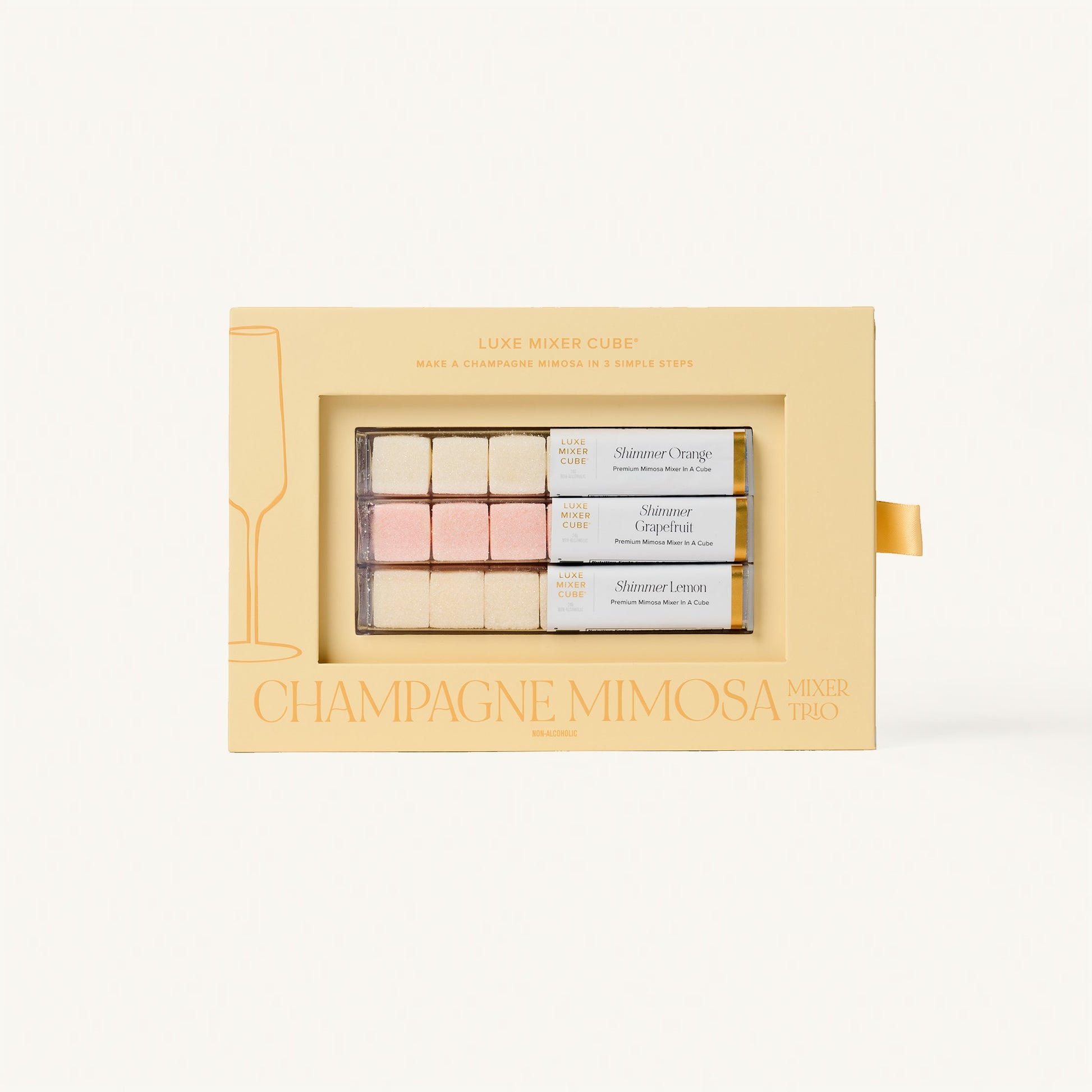 Luxe Champagne Mimosa Mixer Cube Trio: 18 shimmering orange, grapefruit, and lemon flavored cubes in a beige box.
