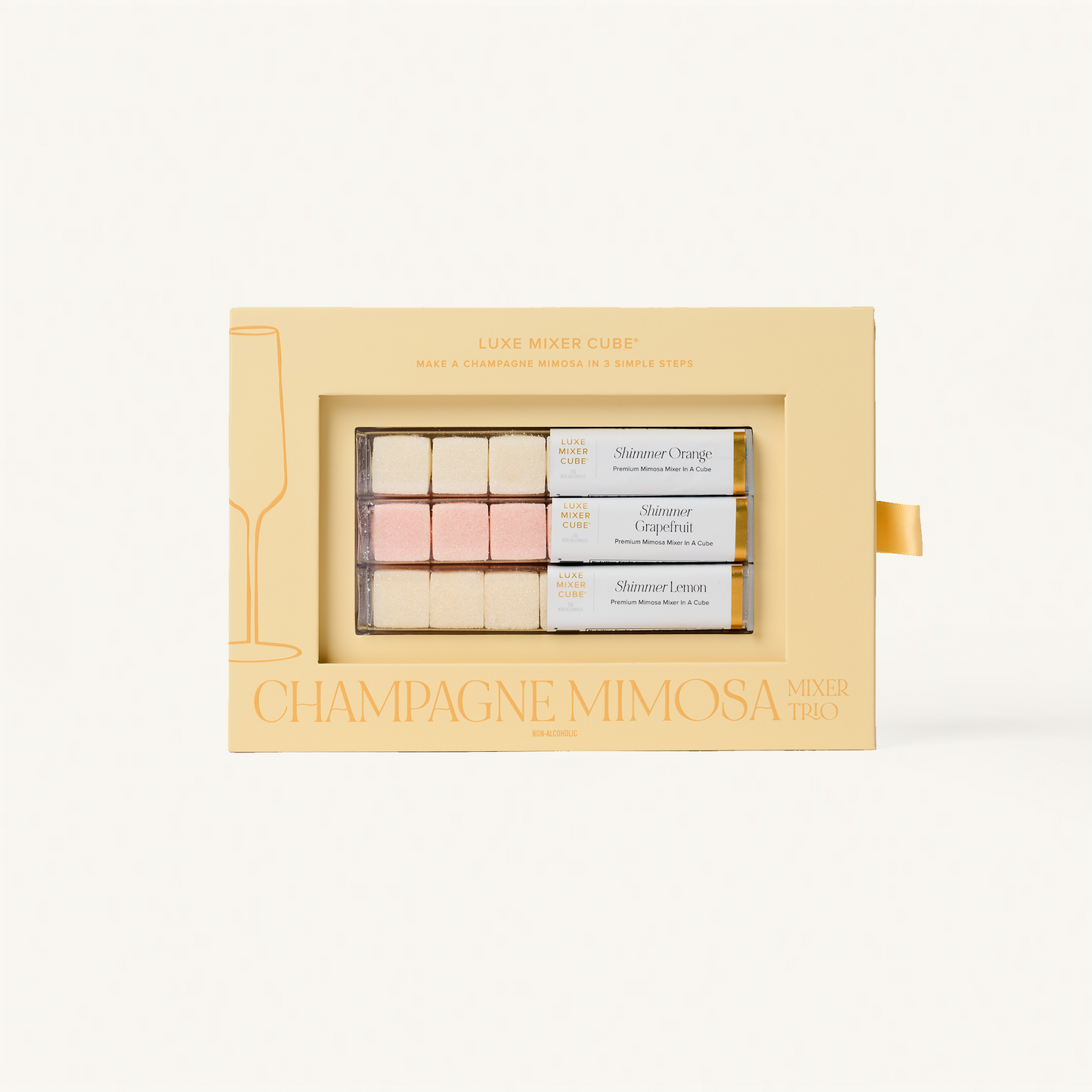 Luxe Champagne Mimosa Mixer Cube Trio: 18 shimmering orange, grapefruit, and lemon flavored cubes in a beige box.