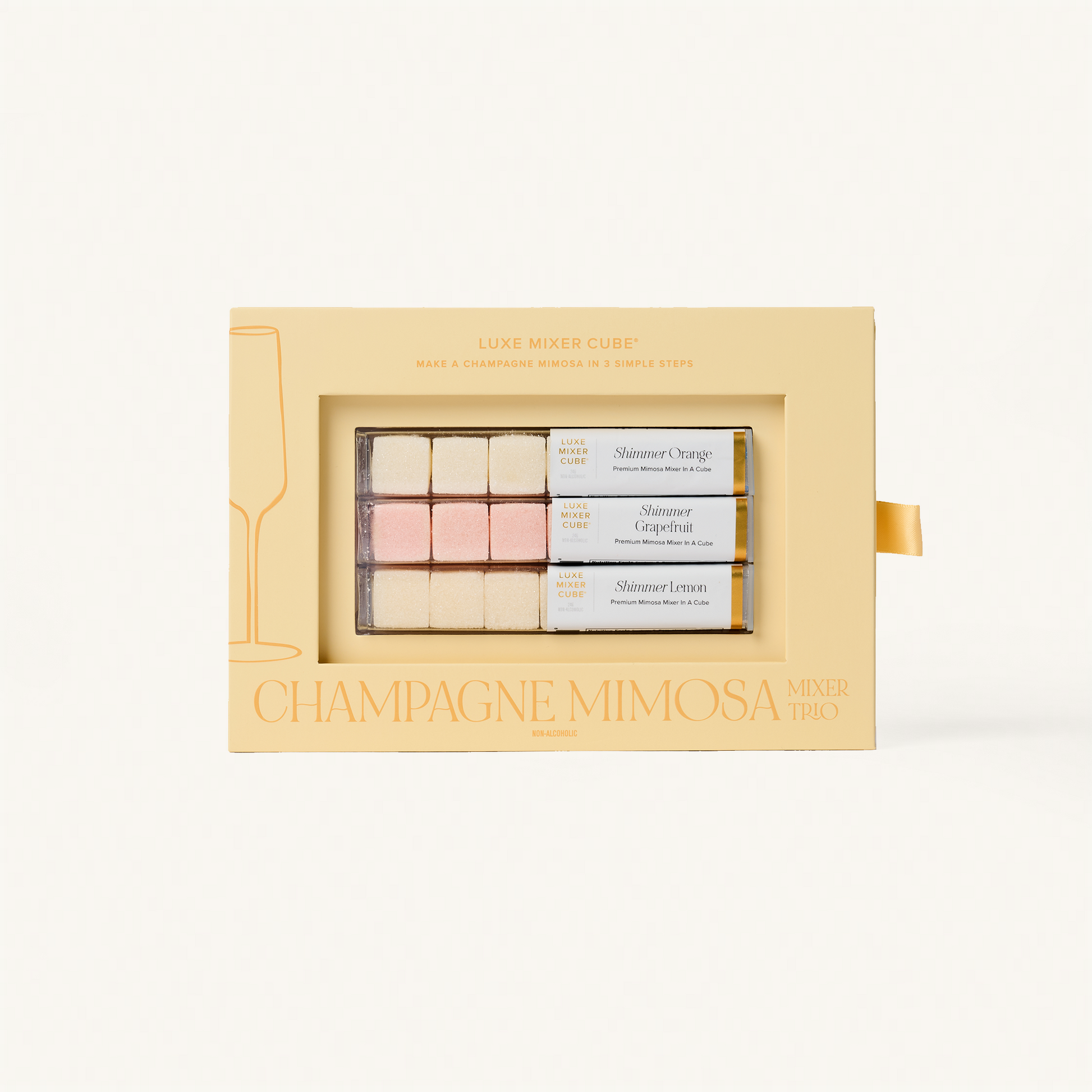 Luxe Champagne Mimosa Mixer Cube Trio: 18 shimmering orange, grapefruit, and lemon flavored cubes in a beige box.