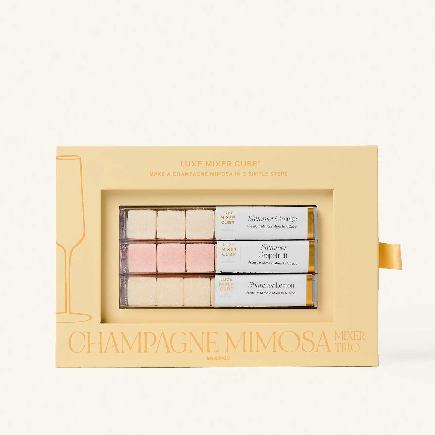 Luxe Champagne Mimosa Mixer Cube Trio: 18 shimmering orange, grapefruit, and lemon cubes in a beige box.