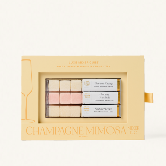 Luxe Champagne Mimosa Mixer Cube Trio: 18 shimmering orange, grapefruit, and lemon cubes in a beige box.