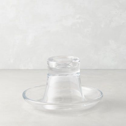 Clear glass Luz Candleholder Small, mouth-blown, with a wide base and narrow top, on a light background.