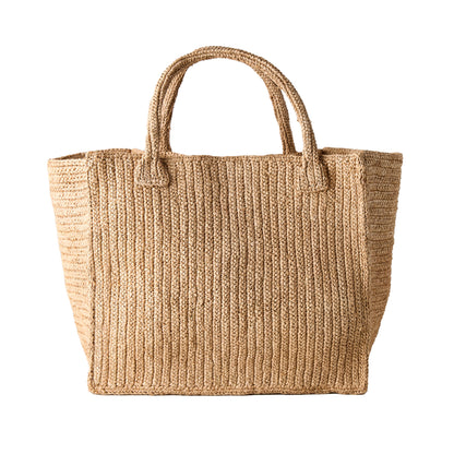Madagascar Packable Raffia Tote Bag, natural tea-dyed, crocheted texture, with two handles.
