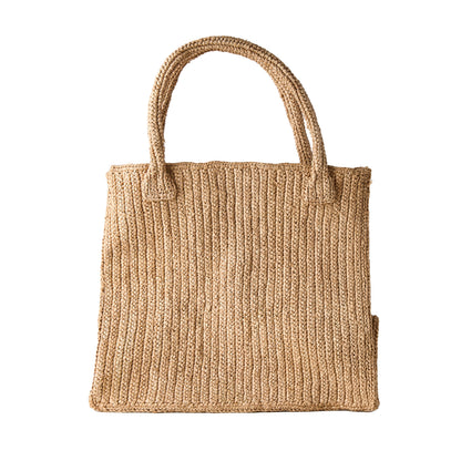 Madagascar Packable Raffia Tote Bag, natural sun-dyed crocheted raffia, with two woven handles.