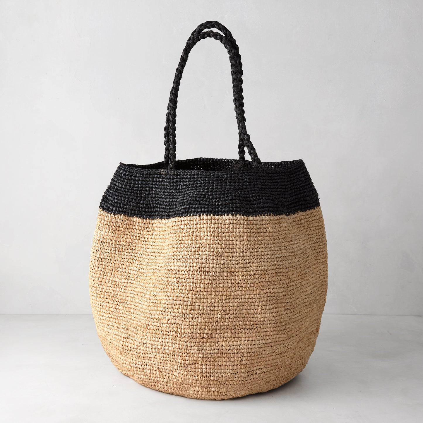 Madrague Black Single Stripe Woven Tote Bag, natural raffia with black crocheted top and handles.