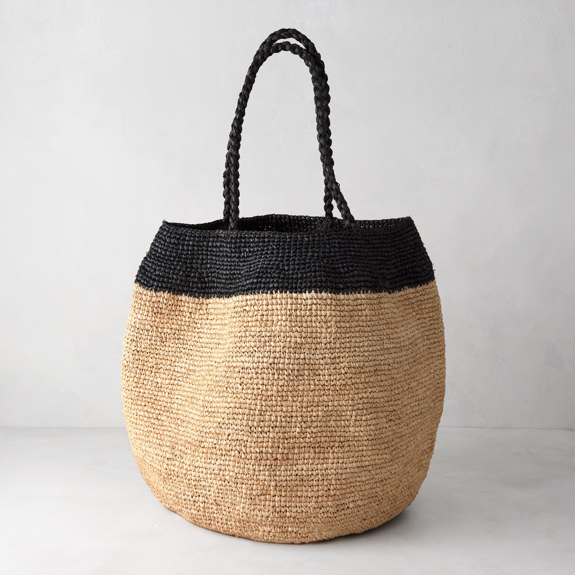 Madrague Black Single Stripe Woven Tote Bag, natural raffia with black crocheted top and handles.