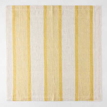 Madras Marigold and Natural Stripe Cotton Napkin, 22" square, with yellow stripes on a beige base.